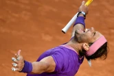 L'Espagnol Rafael Nadal exulte après sa victoire en finale du Masters 1000 de Rome sur le Serbe Novak Djokovic, le 16 mai 2021