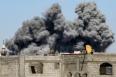Un nuage de fumée s’élève après un bombardement israélien sur le camp de réfugiés palestiniens de Bureij, dans le centre de la bande de Gaza, le 23 mai 2025