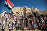 Des écoliers égyptiens vêtus de tenues traditionnelles lors d?une célébration pour marquer l?inauguration de la forteresse de Shali après sa restauration, dans l?oasis désertique égyptienne de Siwa, à environ 600 km au sud-ouest du Caire, le 6 novembre 2020