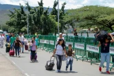 Des Vénézuéliens traversent la frontière depuis leur pays vers la ville de Cucuta en Colombie, sur le pont Simon Bolivar, le 19 août 2018