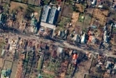 Image satellite diffusée par la société Maxar Technologies le 4 avril 2022, montrant des habitations et des véhicules détruits à Boutcha (Ukraine) le 31 mars 2022