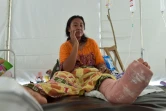 Une patiente dans un hôpital de fortune à Mataram en Indonésie, le 09 août 2018