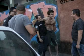 Dans la favela de Tavares Bastos à Rio, des acteurs répètent une scène du prochain film sur la politique de "pacification" des favelas, le 17 juillet 2018