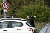 Un policier sur les lieux d'une collision qui a fait quatre morts, dont trois policiers, le 21 mai 2023 près de Lille