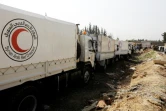 Des véhicules transportant des aides à destination de la Ghouta orientale assiégée au point de passage d'al-Wafidin en périphérie de Damas,  le 5 mars 2018 