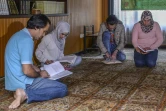 Hadi Hussein, Malak Hadi Hussein, Mohammad Hadi Hussein and Alaa Hasan Ahmed, prient ensemble à la Maison culturelle islamique Ahlul Bayt, à Bogota le 8 avril 2017