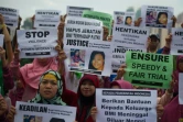 Des immigrées indonésiennes manifestent le 24 octobre 2016 à Hong kong devant le tribunal où est jugé le banquier britannique Rurik Jutting accusé du  meurtre de deux jeunes Indonésiennes