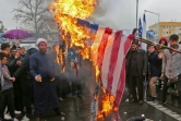 Des Iraniens brûlent un drapeau américain en marge des commémorations du 40e anniversaire de la Révolution islamique, le 11 février 2019 à Téhéran
