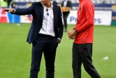 Kylian Mbappé en tenue de ville avec son entraîneur Thomas Tuchel après la victoire du Paris SG contre Lyon en finale de la Coupe de la Ligue le 31 juillet 2020 au Stade de France