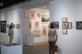 Des visiteurs, le 3 juillet 2018, à l'exposition "1968, quelle histoire !" lors des Rencontres photographiques d'Arles 