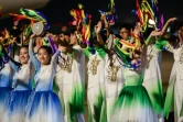 Des écoliers chinois accueillent les invités au Forum de la coopération Chine-Afrique à Pékin