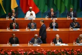 Le président chinois Xi Jinping (C) est applaudi avant de prononcer son discours lors du sommet du Forum sur la coopération Chine-Afrique, à Pékin le 5 septembre 2024