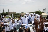 Le chef de l'Union des forces pour la démocratie et le développement (UFDD), Mahamat Nouri (C), salut ses partisans à son arrivée à N'Djamena, le 18 août 2022, après 16 ans d'exil 