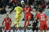 Duel aérien entre le Nantais Emiliano Sala et Corentin Tolisso de Lyon au stade de La Beaujoire, le 1er décembre 2015