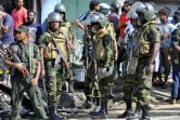 Des forces de police sri-lankaises déployées dans les rues de Pallekele, le 6 mars 2018 après la proclamation de l'état d'urgence