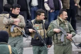 Photo de forces de sécurité kurdes irakiennes lors d'une manifestation, le 19 décembre 2017 à Suleimaniyeh