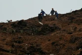 Des secouristes sur le site où un Boeing 737-800 de la China Eastern Airlines s'est écrasé, à Wuzhou, dans le sud de la Chine