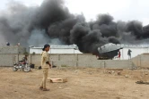 Dans la fumée s'élève au dessus d'un camp militaire dans le nord de la ville d'Aden, le 31 janvier 2018, après les combats entre des forces séparatistes du sud du Yémen et des troupes gouvernementales