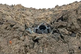 Un débris de roquette non loin de la ligne de front, près de Kharkiv, le 17 avril 2022 en Ukraine