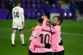 Les joueurs du FC Barcelone fêtent le 644e but de Lionel Messi avec son club, en marquant sur le terrain de Valladolid, le 22 décembre 2020