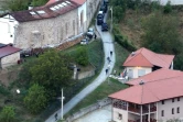 Photo diffusée par le gouvernement du Kosovo le 24 septembre 2023 montrant des véhicules blindés devant le monastère de Banjska où sont retranchés des hommes armés, dans le nord du Kosovo
