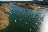 Menacés de s'échouer avec la baisse du niveau d'eau sous l'effet de la sécheresse, des dizaines de bateaux vont devoir être sortis du lac d'Oroville, dans le nord de la Californie, ici le 24 mai 2021