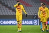 Les joueurs du FC Barcelone, abattus après leur élimination de la Ligue des champions sur la peouse du Bayern Munich v FC Barcelone, le 8 décembre 2021 