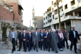 Photo fournie par l'agence officielle syrienne SANA, de Bachar al-Assad lors d'une visite le 12 septembre 2016 dans l'ex-fief rebelle de Daraya
