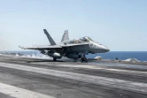 Un F18 s'envole du pont du porte-avions Truman le 6 juin 2016 pour mener une opération militaire au-dessus de la Syrie