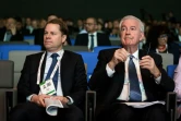 Le directeur général de l'AMA Olivier Niggli et son président Sir Craig Reedie lors du symposium sur le dopage à Lausanne, le 13 mars 2019