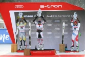 Le vainqueur du slalom géant d'Alta Badia, le Français Alexis Pinturault, entouré du Norvégien Atle Lie McGrath (2e, g) et du Suisse Justin Murisier