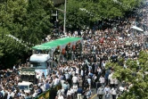 Des Iraniens participent aux funérailles publiques de 150 "martyrs" morts durant la guerre Iran-Irak (1980-1988), le 27 juin 2019 à Téhéran