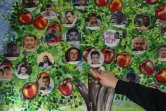 Des photos de disparus accrochées sur un mur de la prison de Saydnaya à Damas, le 11 décembre 2024.