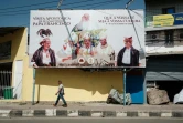 Un mur repeint en jaune pour cacher une fresque représentant Mgr Carlos Belo, le 7 septembre 2024 à Dili, au Timor oriental