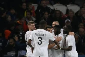 L'attaquant canadien de Lille Jonathan David (c), félicité par ses coéquipiers après son but marqué contre le Paris Saint-Germain, lors de leur match de Ligue 1, le 29 octobre 2021 au Parc des Princes