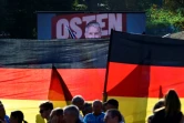 Meeting du parti d'extrême droite AfD, avec en arrière-plan un écran montrant son leader en Thuringe Björn Höcke, le 31 août 2024 à Erfurt, dans l'est de l'Allemagne