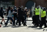 Heurts entre policiers et manifestants à Liverpool le 3 août 2024, lors de la manifestation "Enough is Enough" organisée après une attaque mortelle au couteau à Southport, le 29 juillet 2024