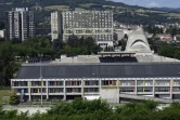 Vue, le 1er juillet 2016, de la Maison de la Culture (en bas) et de l'église Saint-Pierre (2e plan à droite) construites par Le Corbusier dans les années 50 à Firminy, près de Saint-Etienne (Loire)