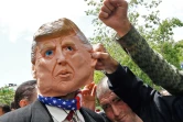Des Iraniens manifestent à Téhéran contre les Etats-Unis en portant un masque à l'effigie du président américain Donald Trump, le 10 mai 2019