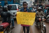 La jeune Ougandaise Leah Namugerwa, 15 ans, manifeste contre le réchauffement climatique, le 4 septembre à Kampala.

