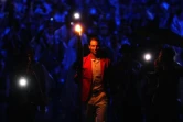 Le tennisman espagnol Rafael Nadal porte la flamme olympique lors de la cérémonie d'ouverture des JO à Paris, le 26 juillet 2024