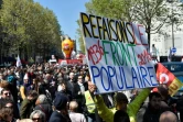 Un manifestant brandit une pancarte lors d'une manifestation le 1er mai 2016 à Paris