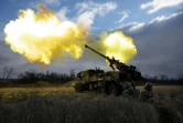Des militaires ukrainiens tirent avec un obusier automoteur Caesar vers des positions russes dans l'est de l'Ukraine, le 28 décembre 2022