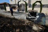 Des Palestiniens inspectent les dégâts après une attaque de colons juifs contre le village de Jit en Cisjordanie occupée, le 16 août 2024 