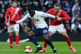 Le milieu de Tottenham Tanguy Ndombélé tente de se défaire du double marquage des défenseurs de Morecambe à Londres, le 9 janvier 2022 