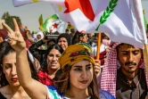 Des Kurdes manifestent contre la possibilité d'une offensive turque dans le nord de la Syrie, à Ras al-Aïn, le 6 octobre 2019
