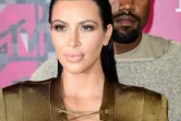 Le rappeur Kanye West (d) et son épouse Kim Kardashian à Los Angeles, le 30 août 2015