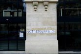 Une inscription faite sur un mur lors d'une marche blanche le 3 janvier 2021 à Paris en mémoire de Cédric Chouviat, un livreur mort à Paris en janvier 2020 après un contrôle de police