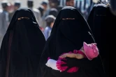 Des femmes détenues se préparent à quitter, après leur libération, le camp d'al-Hol qui accueille des proches de combattants présumés du groupe État islamique (EI), le 3 septembre 2023 dans le nord-est de la Syrie