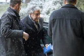 Le dirigeant chypriote turc Mustafa Akinci (c) arrive pour le 2e jour de négociations pour la réunification de l'île, le 10 janvier 2017 à Genève